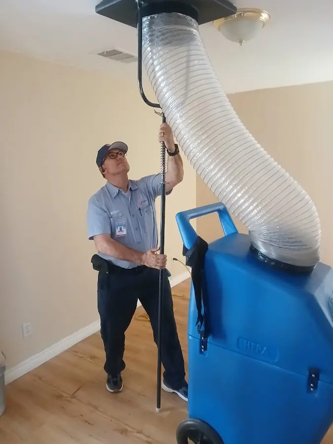 Furnace Tune-Up technician using HEPA equipment in Sweetwater